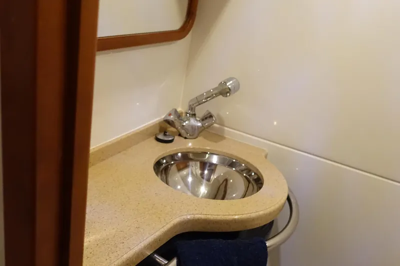 Slide: The Image of 2007 Chris-Craft Roamer 40 yacht bathroom sink with modern fixtures and countertop. - 29