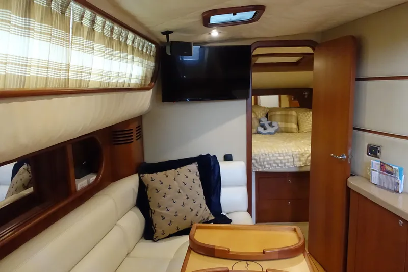 Slide: The Image of Luxurious interior of 2007 Chris-Craft Roamer 40 yacht with cozy seating and elegant decor. - 30