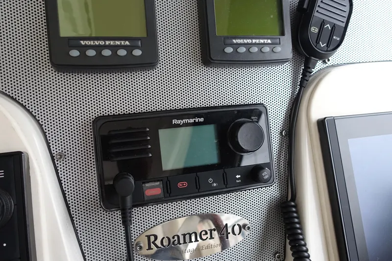 Slide: The Image of Control panel of 2007 Chris-Craft Roamer 40 with Raymarine and Volvo Penta displays. - 5