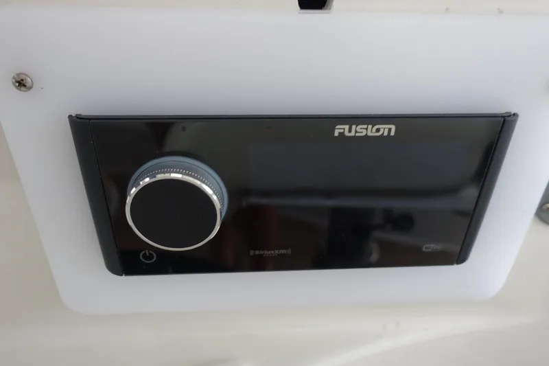 Slide: The Image of Fusion audio system on 2007 Chris-Craft Roamer 40 yacht dashboard. - 7