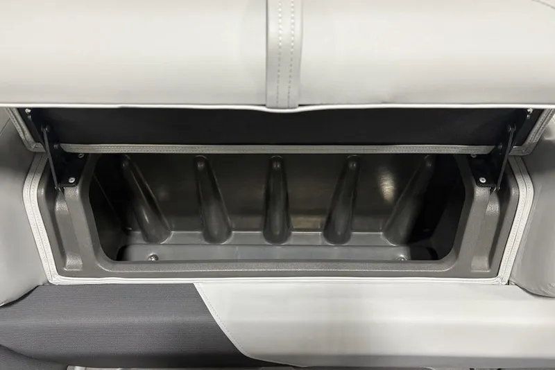 Slide: The Image of 2026 Sun Tracker PARTY BARGE® 22 XP3 storage compartment with open lid, showcasing interior space. - 28