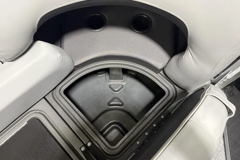 Slide: The Image of 2026 Sun Tracker PARTY BARGE® 22 XP3 storage compartment with cup holders and cushioned seating. - 29