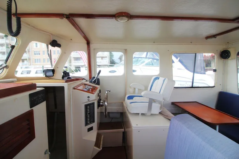 Slide: The Image of Interior of 2002 Rosborough RF-246 Sedan Cruiser with captain's chair and control panel. - 11