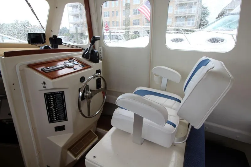 Slide: The Image of Interior of 2002 Rosborough RF-246 Sedan Cruiser with helm and seating. - 14