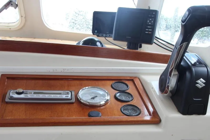 Slide: The Image of Control panel of 2002 Rosborough RF-246 Sedan Cruiser with gauges and throttle lever. - 16