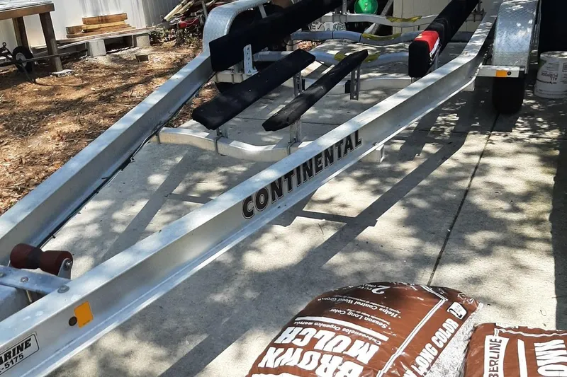 Slide: The Image of Trailer for 2002 Rosborough RF-246 Sedan Cruiser, labeled "Continental," on concrete driveway. - 22