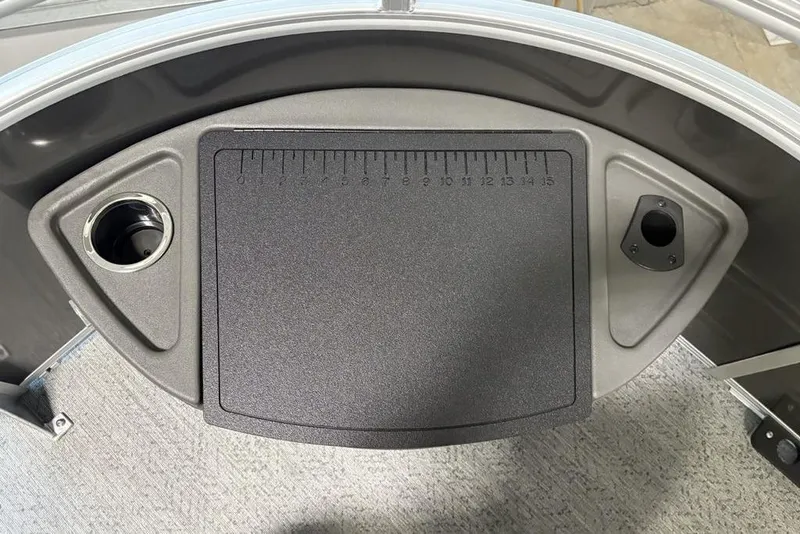 Slide: The Image of 2026 Sun Tracker Fishin' Barge 22 XP3 fishing station with ruler and cup holder. - 10