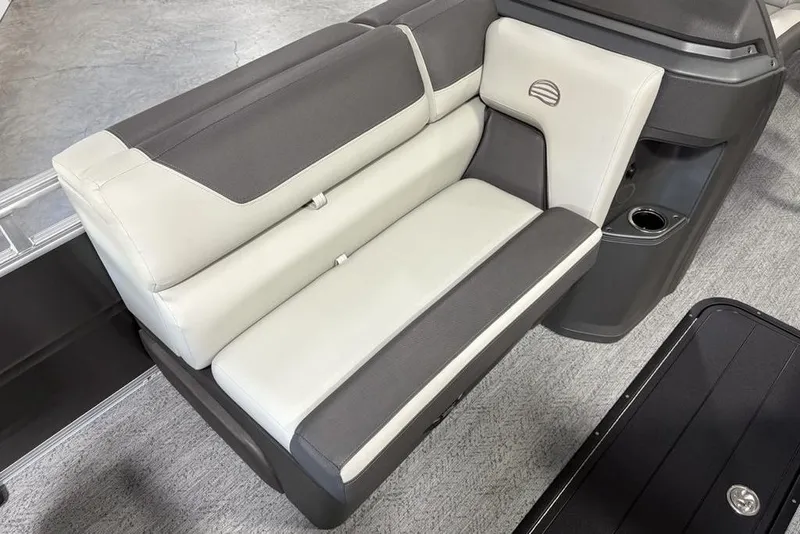 Slide: The Image of 2026 Sun Tracker Fishin' Barge 22 XP3 boat seat, gray and white upholstery, cup holder. - 13