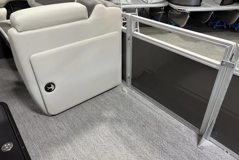 Slide: The Image of Interior of 2026 Sun Tracker Fishin' Barge 22 XP3, featuring seating and railing. - 15