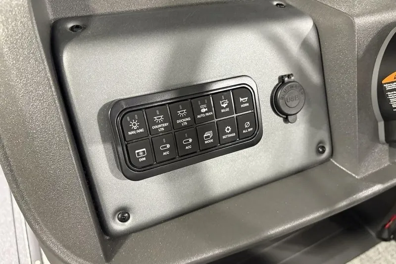 Slide: The Image of Control panel of 2026 Sun Tracker Fishin' Barge 22 XP3 with various function buttons. - 20