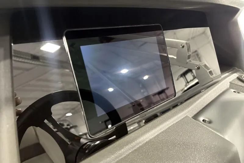 Slide: The Image of Dashboard of 2026 Sun Tracker Fishin' Barge 22 XP3 with modern touchscreen display. - 22