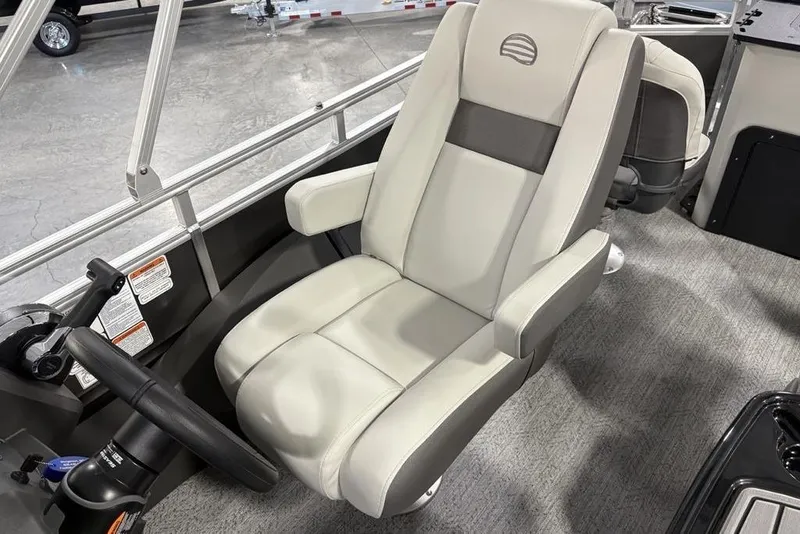 Slide: The Image of 2026 Sun Tracker Fishin' Barge 22 XP3 captain's chair, featuring sleek design and comfortable seating. - 24