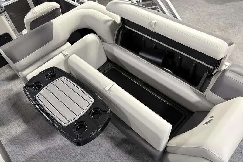 Slide: The Image of 2026 Sun Tracker Fishin' Barge 22 XP3 interior with seating and storage compartments. - 27