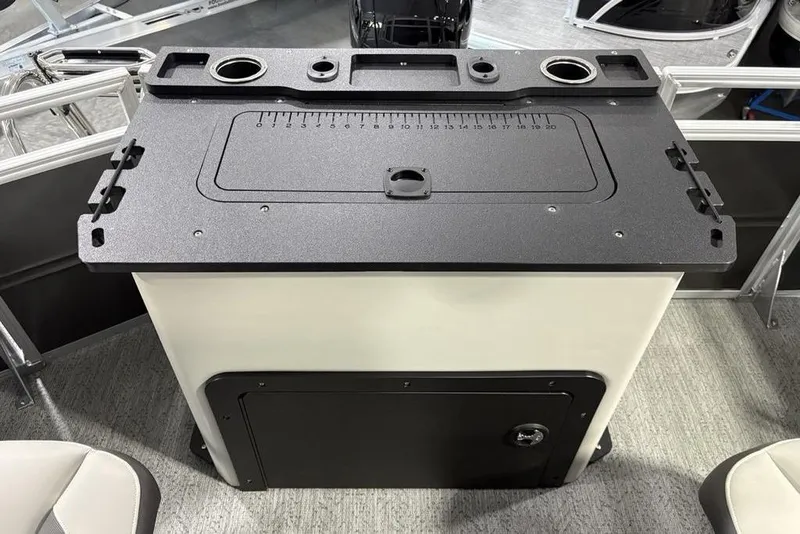 Slide: The Image of 2026 Sun Tracker Fishin' Barge 22 XP3 fishing station with measurement markings and cup holders. - 33