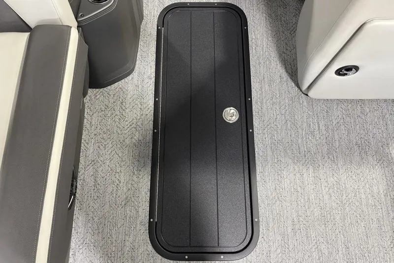 Slide: The Image of 2026 Sun Tracker Fishin' Barge 22 XP3 interior floor storage compartment. - 6