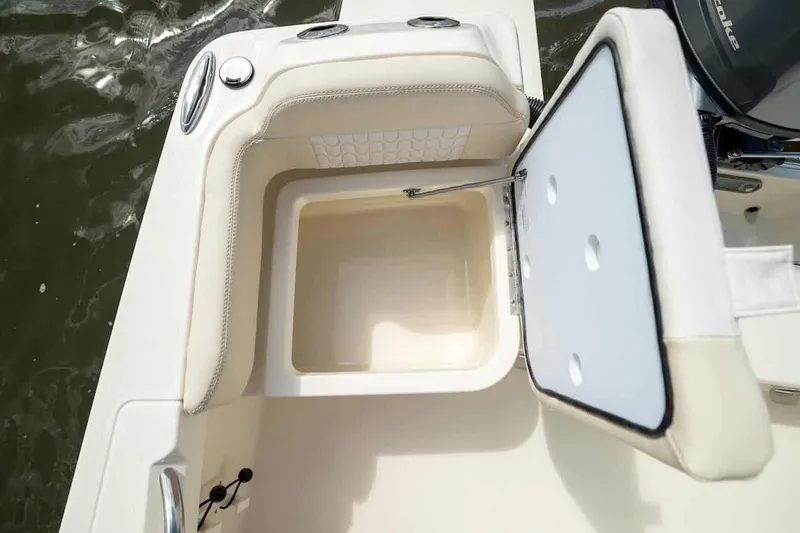 Slide: The Image of 2026 Scout 188 Sportfish boat with open storage compartment, showcasing interior design. - 12