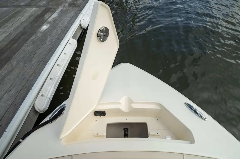 Slide: The Image of Bow view of 2026 Scout 188 Sportfish boat at dockside. - 13