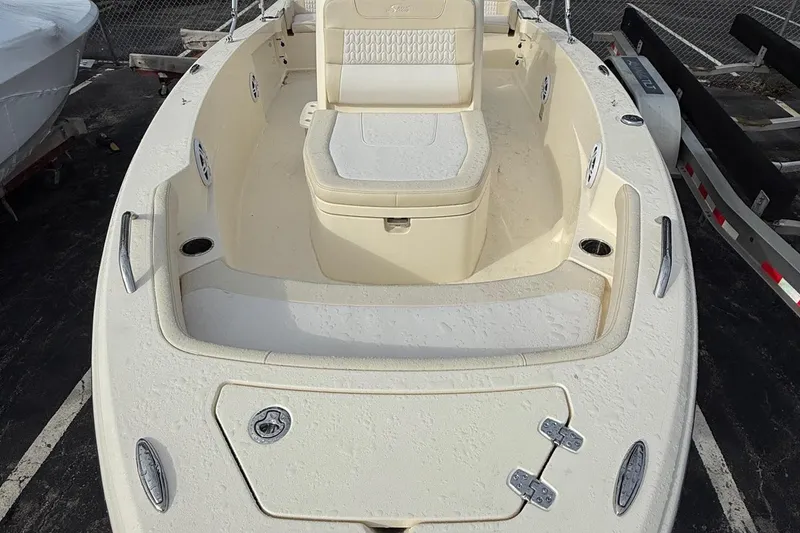 Slide: The Image of 2026 Scout 188 Sportfish boat interior with seating and storage compartments. - 18