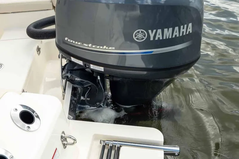 Slide: The Image of 2026 Scout 188 Sportfish with Yamaha four-stroke outboard engine on water. - 19