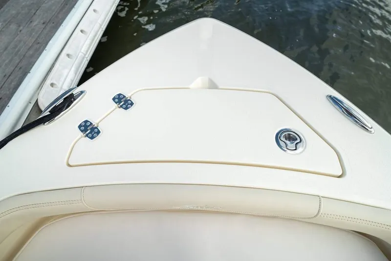 Slide: The Image of 2026 Scout 188 Sportfish boat bow with storage compartment and sleek design. - 8