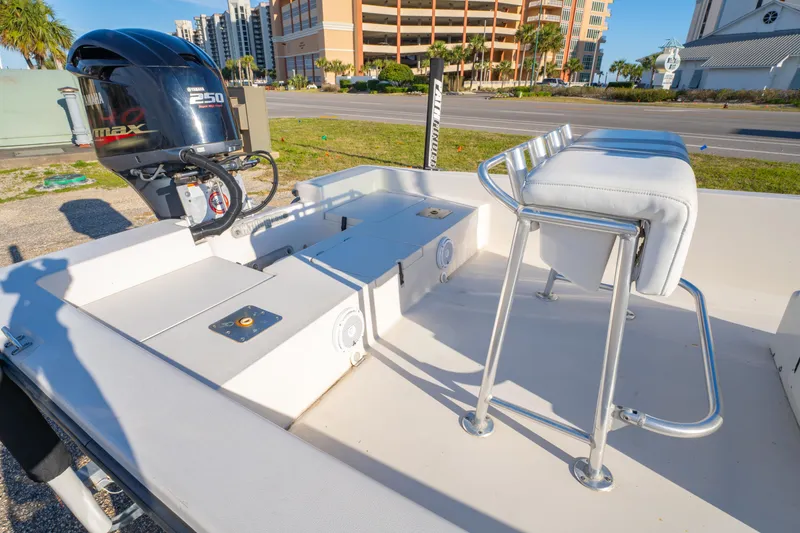 Slide: The Image of 2001 Pathfinder 2400-V boat with Yamaha 250 engine, docked near urban buildings. - 10