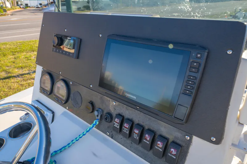 Slide: The Image of Dashboard of a 2001 Pathfinder 2400-V boat with Garmin navigation system. - 18