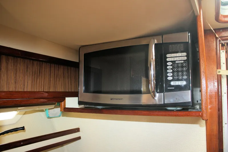 Slide: The Image of Microwave inside 1980 Sea Ray 300 Weekender boat kitchen area. - 19