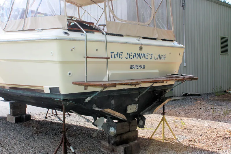 Slide: The Image of 1980 Sea Ray 300 Weekender boat named "The Jeannie's Lamp" on dry dock in Wareham. - 4