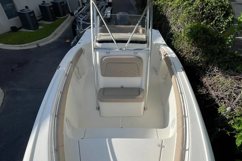 Slide: The Image of 2006 Scout 242 Sportfish boat, top view, showcasing seating and console area. - 10