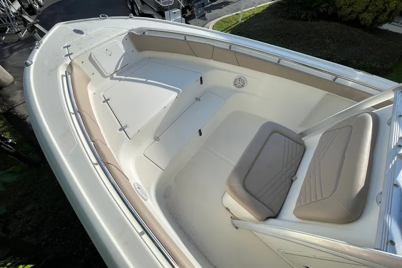 Slide: The Image of 2006 Scout 242 Sportfish boat interior with seating and storage compartments. - 11