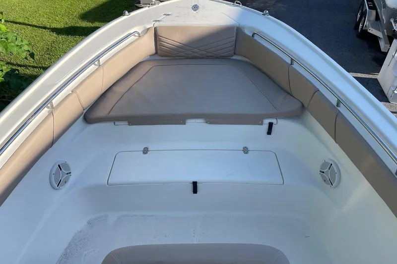 Slide: The Image of 2006 Scout 242 Sportfish boat interior with cushioned seating and storage compartment. - 14