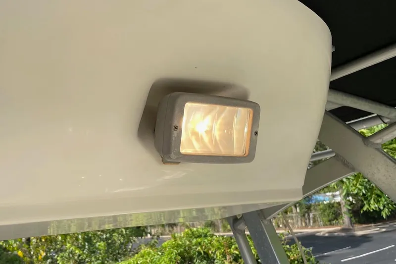 Slide: The Image of 2006 Scout 242 Sportfish boat light fixture, mounted under canopy. - 24