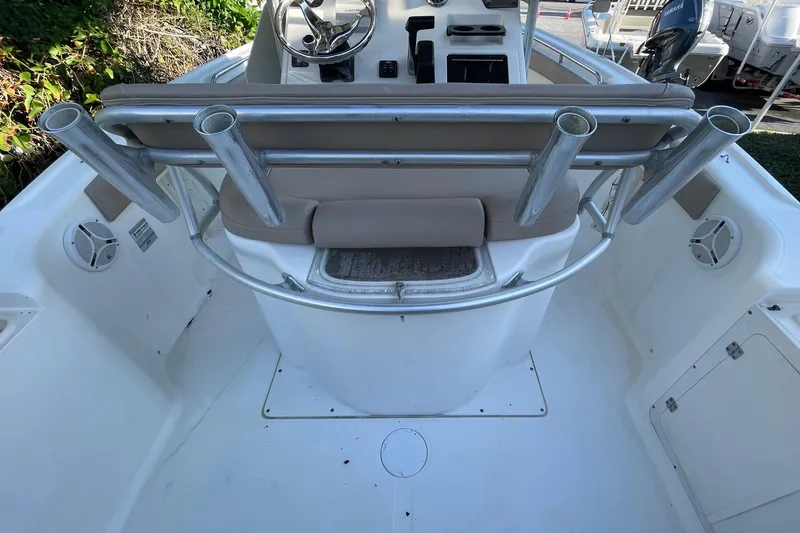Slide: The Image of 2006 Scout 242 Sportfish boat interior with rod holders and steering console. - 29