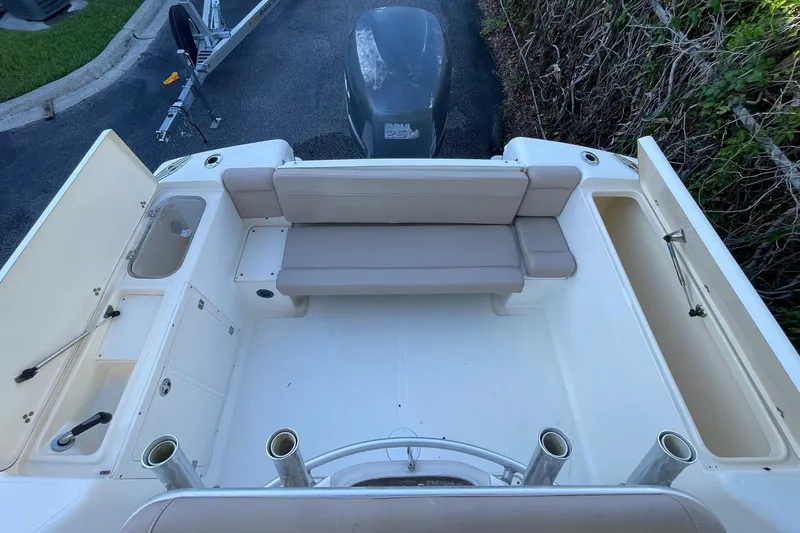 Slide: The Image of 2006 Scout 242 Sportfish boat interior with seating and storage compartments. - 31