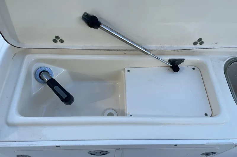 Slide: The Image of 2006 Scout 242 Sportfish boat sink with faucet and storage compartment. - 34