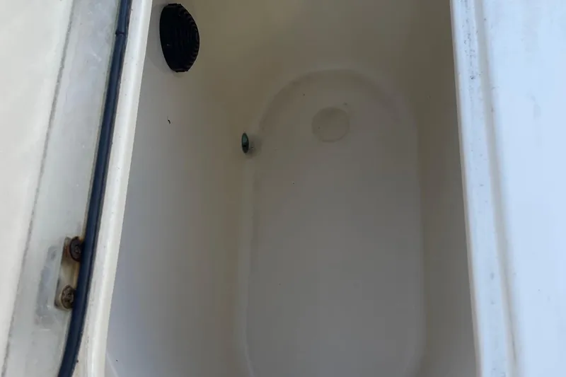 Slide: The Image of Open storage compartment on 2006 Scout 242 Sportfish boat. - 35