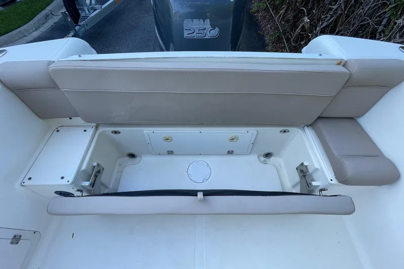 Slide: The Image of 2006 Scout 242 Sportfish boat interior with seating and storage compartments. - 38