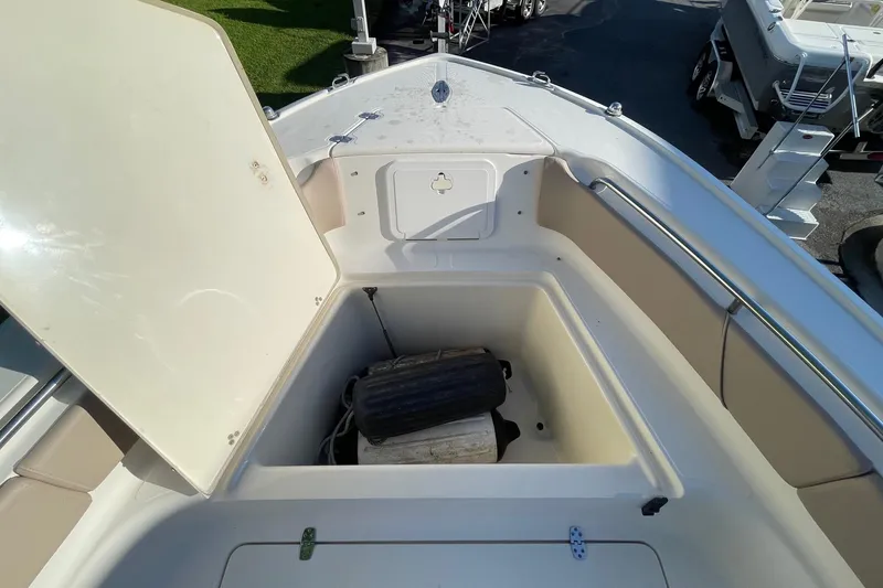 Slide: The Image of Open storage compartment on 2006 Scout 242 Sportfish boat, showing interior space and equipment. - 40