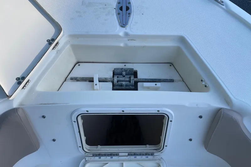 Slide: The Image of Anchor storage compartment on a 2006 Scout 242 Sportfish boat. - 42