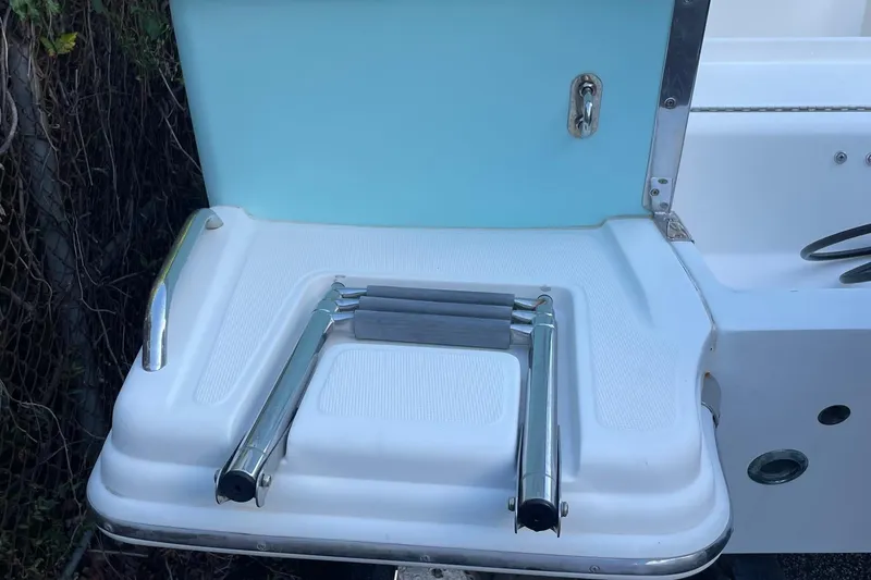 Slide: The Image of 2006 Scout 242 Sportfish boat swim platform with foldable ladder. - 43
