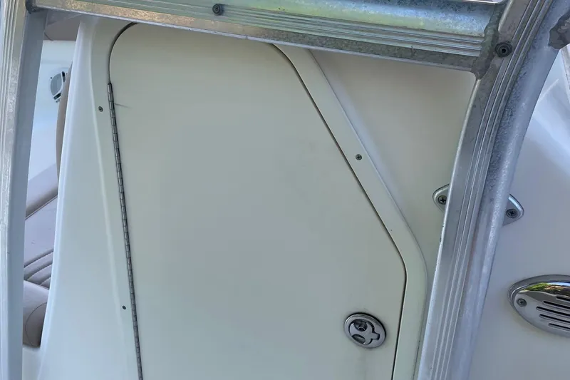 Slide: The Image of 2006 Scout 242 Sportfish boat interior with metal frame and storage compartment. - 47