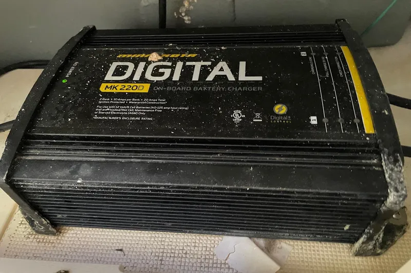 Slide: The Image of Minn Kota MK 220D digital on-board battery charger on a 2006 Scout 242 Sportfish. - 53