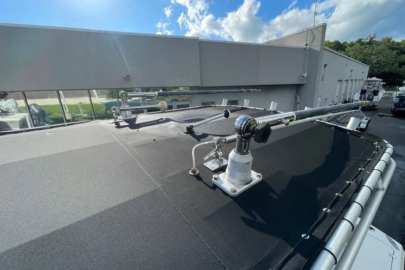 Slide: The Image of Rooftop view of a 2006 Scout 242 Sportfish boat under a clear blue sky. - 54