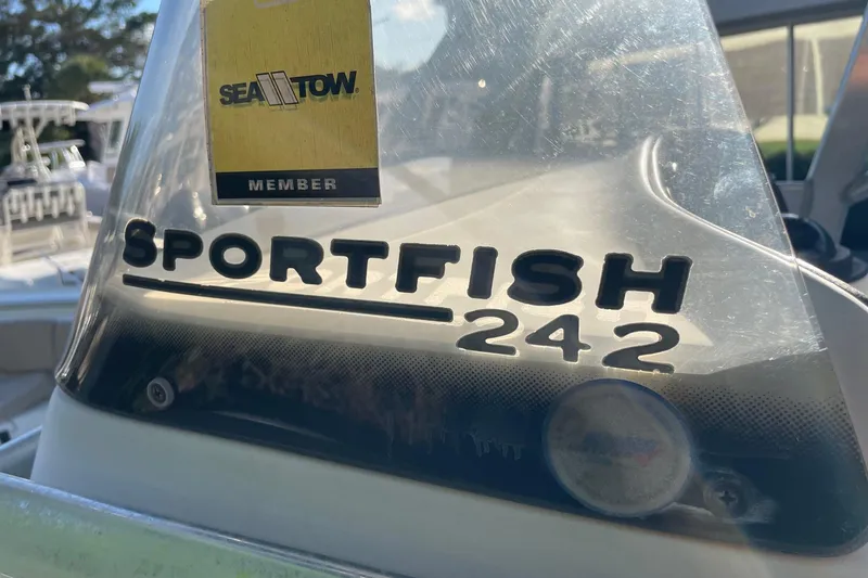 Slide: The Image of 2006 Scout 242 Sportfish boat with Sea Tow membership sticker. - 55