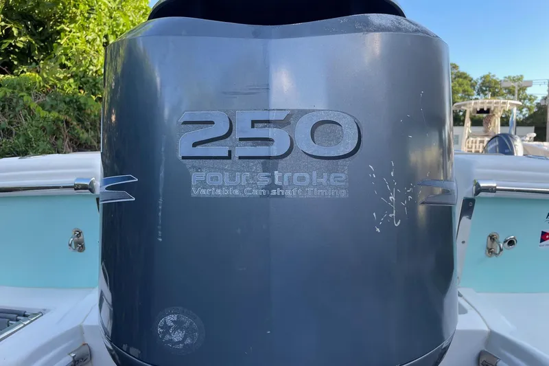 Slide: The Image of Outboard motor on a 2006 Scout 242 Sportfish boat, featuring 250 horsepower. - 61