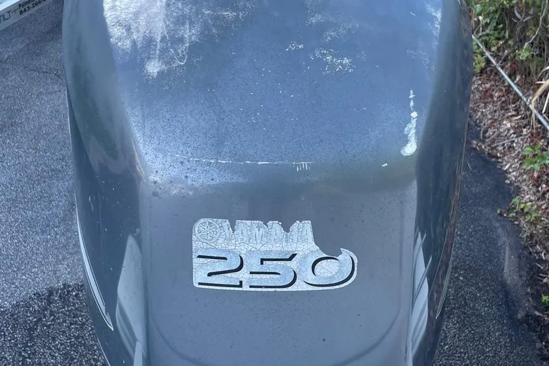 Slide: The Image of Outboard motor with "250" decal on a 2006 Scout 242 Sportfish boat. - 62