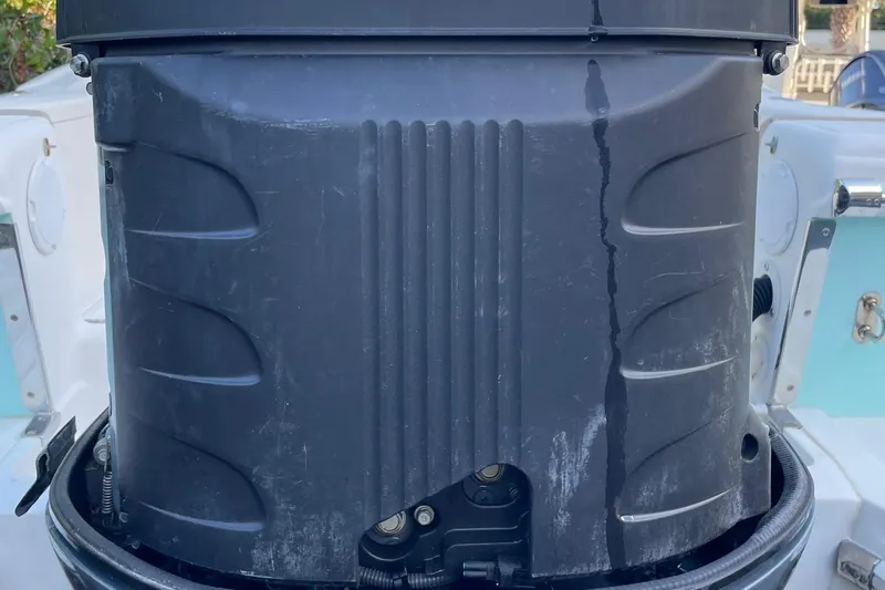 Slide: The Image of Close-up of a 2006 Scout 242 Sportfish boat engine, showing wear and tear. - 66