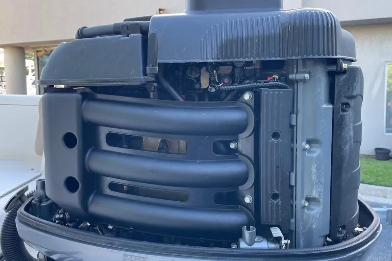 Slide: The Image of Close-up of a 2006 Scout 242 Sportfish engine, showcasing intricate mechanical details. - 67