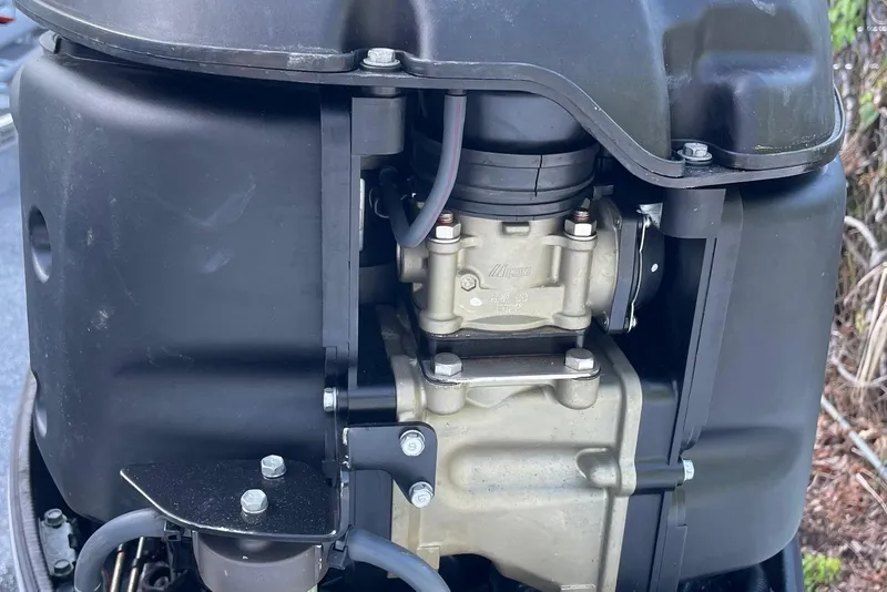 Slide: The Image of Close-up of a 2006 Scout 242 Sportfish engine component, showcasing mechanical details. - 68