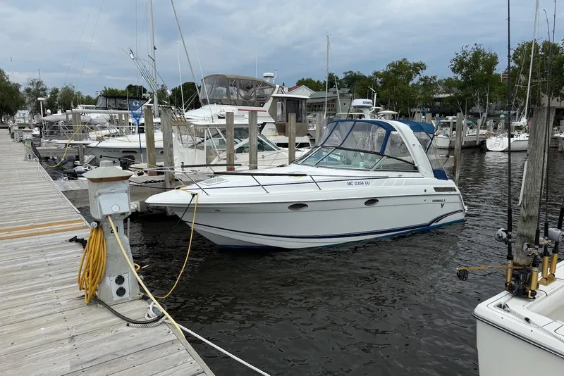 The Image of 2007 Formula 27 PC boat docked at a marina with other vessels. - 0